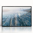 Framed acrylic wall art depicting a stunning glacier landscape in vibrant blues and whites, showcased with a sleek black frame, perfect for modern decor.