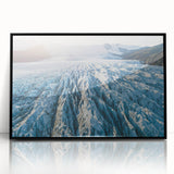 Framed acrylic wall art depicting a stunning glacier landscape in vibrant blues and whites, showcased with a sleek black frame, perfect for modern decor.