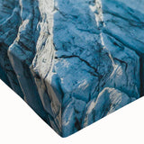 Close-up of a stretched canvas showcasing a vibrant glacier landscape design with intricate details and rich colors, perfect for modern wall art decor.