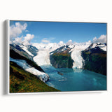 Framed canvas wall art showcasing a stunning glacier landscape design, featuring vibrant blues and whites, elegantly displayed from a side view against a white background.