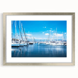Elegant silver-framed wall art display showcasing a serene harbor landscape design, complete with a white mat, ideal for enhancing modern home decor aesthetics.