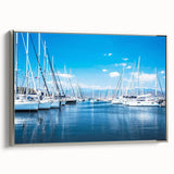 Framed canvas artwork of a serene harbor landscape, showcasing vibrant colors and intricate details, set against a sleek silver frame, ideal for modern home decor.