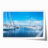 Rolled print showcasing a serene harbor landscape design with vibrant colors, ideal for home decor, elegantly packaged for safe delivery.