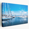 Stretched canvas wall art showcasing a serene harbor landscape, featuring calming blues and greens, designed to enhance modern home decor with a side view display.
