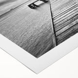 Rolled canvas showcasing a serene harbor landscape design, featuring vivid blues and greens, perfect for home decor. Packaged securely in a cardboard tube.