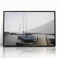 Framed acrylic wall art featuring a serene harbor landscape design, with a sleek black frame, perfect for coastal-themed home decor. Ideal for enhancing living spaces.