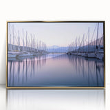Framed acrylic wall art showcasing a serene harbor landscape with gold accents. Ideal for modern decor, this piece adds elegance and tranquility to any space.