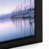 Close-up view of a framed canvas wall art featuring a vibrant harbor landscape design, showcasing rich colors and intricate details, perfect for home decor.