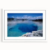 Framed landscape wall art design showcasing a serene hot spring scene with vibrant colors and natural elements, presented in a sleek white mat for an elegant finish.