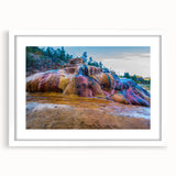 Framed wall art showcasing a serene hot spring landscape with soft colors and intricate details, set against a white mat and frame, perfect for home decor.