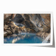 Rolled print showcasing a vibrant hot spring landscape with lush greenery and calming blue waters, designed for wall art display in home decor.