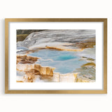 Framed wall art featuring a serene hot spring landscape, elegantly designed with a gold frame and mat, perfect for enhancing home decor and relaxation themes.