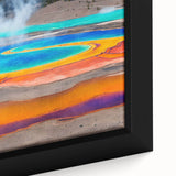Close-up of a framed canvas wall art piece showcasing a vibrant hot spring landscape design with rich colors and intricate details, perfect for home decor.