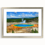 Framed landscape wall art design showcasing a serene hot spring scene with vibrant colors, presented in a silver frame with a white mat for an elegant display.