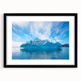 Black-framed wall art featuring a stunning iceberg landscape design, showcasing vibrant blues and whites that evoke a sense of tranquility, ideal for modern decor.