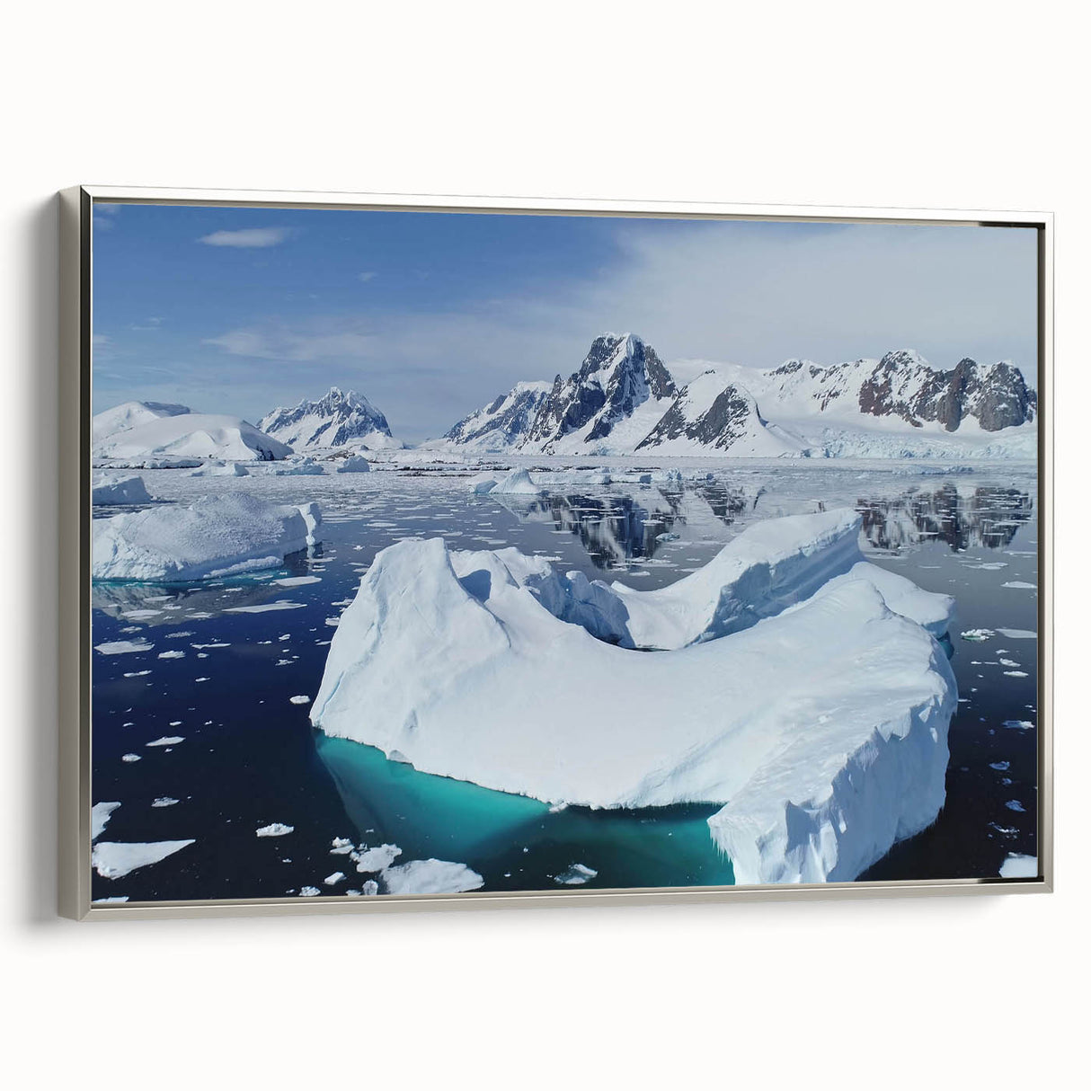 Framed canvas wall art showcasing a stunning iceberg landscape design with silver accents, perfect for modern home decor. The image highlights the unique textures and colors of the icebergs, creating a serene visual impact.