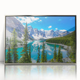 Framed acrylic wall art featuring a serene lake landscape with vibrant colors, elegantly displayed in a silver frame, perfect for enhancing modern home decor.