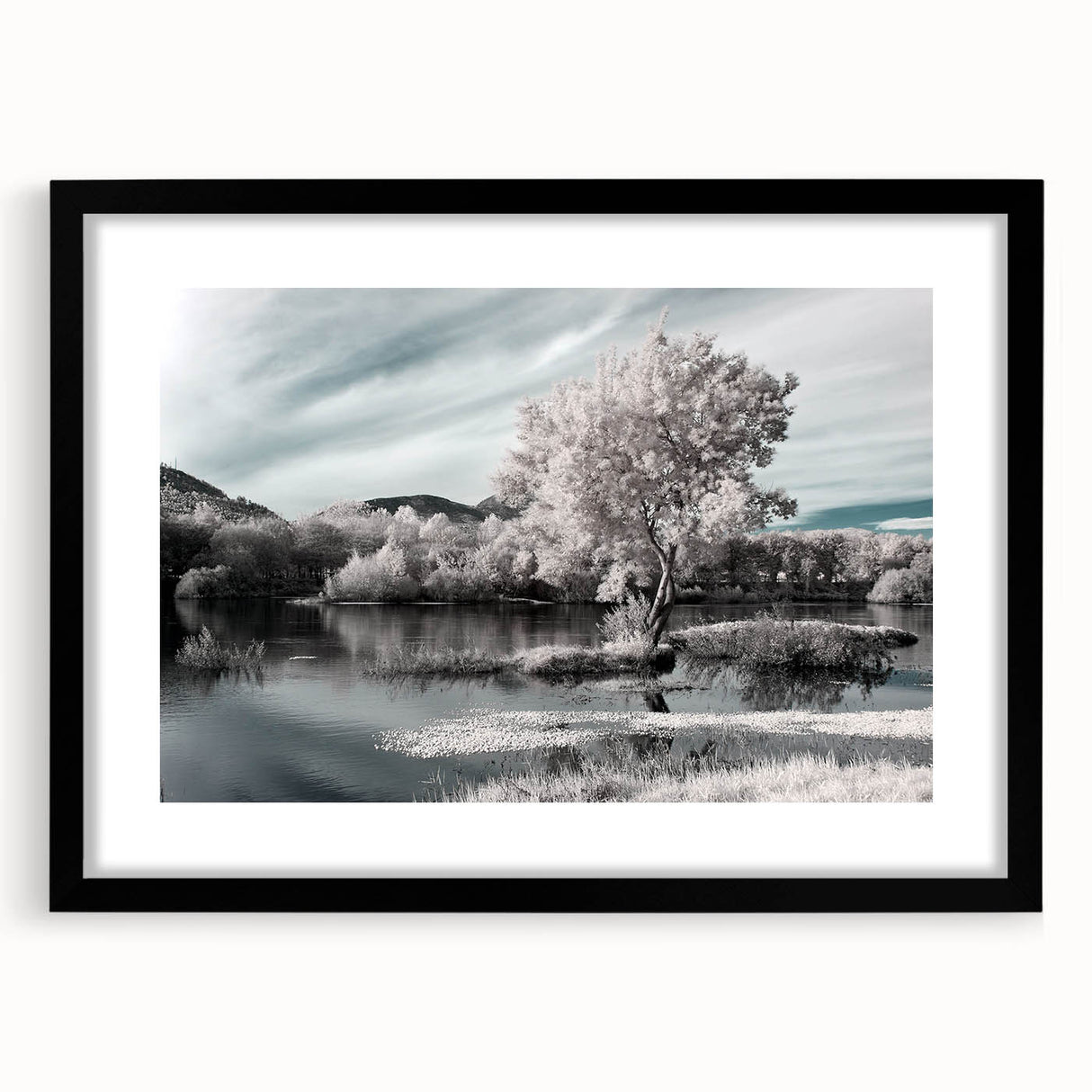 Framed wall art featuring a serene lake landscape, surrounded by a sleek black mat, ideal for home decor. Perfect for nature lovers seeking tranquility.