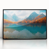 Framed wall art featuring a serene landscape of a tranquil lake surrounded by lush greenery, encapsulated in a sleek black frame, perfect for home decor.