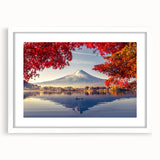 Framed wall art featuring a serene landscape design of a lake surrounded by lush trees, presented in a white mat. Perfect for home decor, creating a calming atmosphere.
