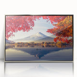 Framed acrylic wall art featuring a serene landscape of a tranquil lake surrounded by lush greenery, elegantly presented with a silver frame, ideal for home decor.