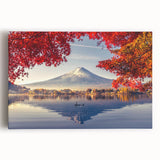 Stretched canvas artwork showcasing a serene lake landscape at sunset, with vibrant colors reflecting on the water, perfect for home decor.