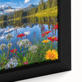 Close-up of a framed canvas wall art piece showcasing a tranquil lake landscape with vibrant colors, perfect for home decor and nature lovers. The artwork features serene blue water, lush greenery, and a peaceful sky, enhancing any living space with its calming aesthetic.