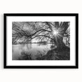 Framed wall art featuring a serene lake landscape design, showcasing vibrant blues and greens, with a sleek black frame and mat, perfect for home decor.