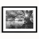 Framed wall art featuring a serene lake landscape design, showcasing vibrant blues and greens, with a sleek black frame and mat, perfect for home decor.