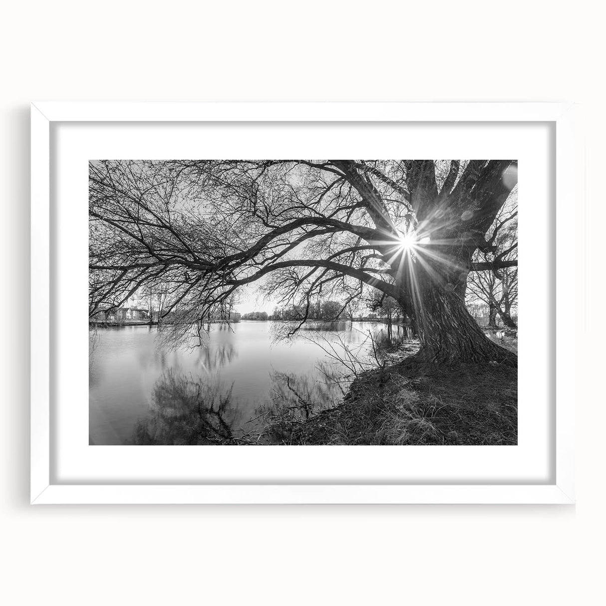 Framed wall art featuring a serene lake landscape design, elegantly displayed with a white mat. Perfect for home decor, adds tranquility and style to any space.