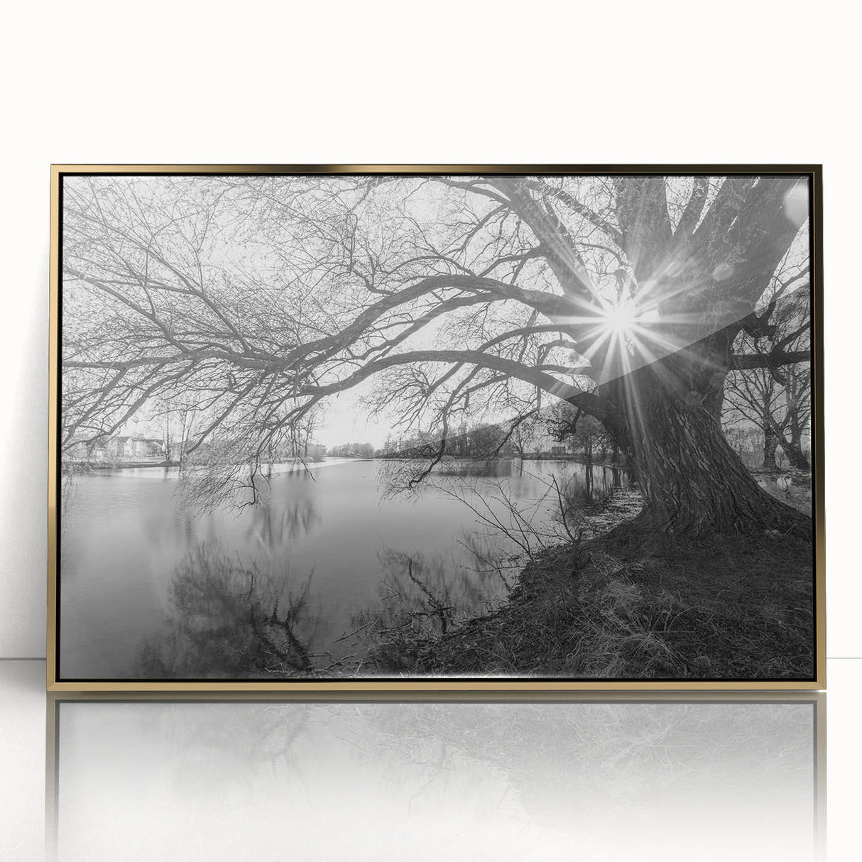 Framed acrylic wall art featuring a serene lake landscape with gold accents, ideal for modern decor. Perfect for enhancing living spaces with nature-inspired elegance.
