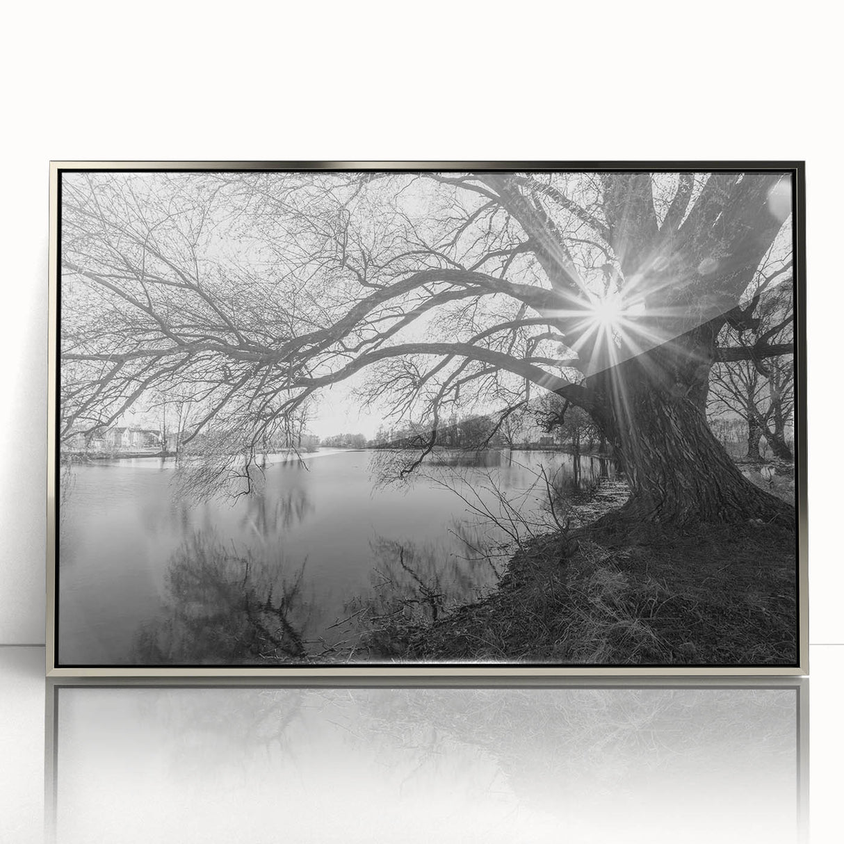 Framed wall art featuring a serene landscape with tranquil lakes, showcased in a sleek silver frame, enhancing any interior decor with its calming aesthetic.