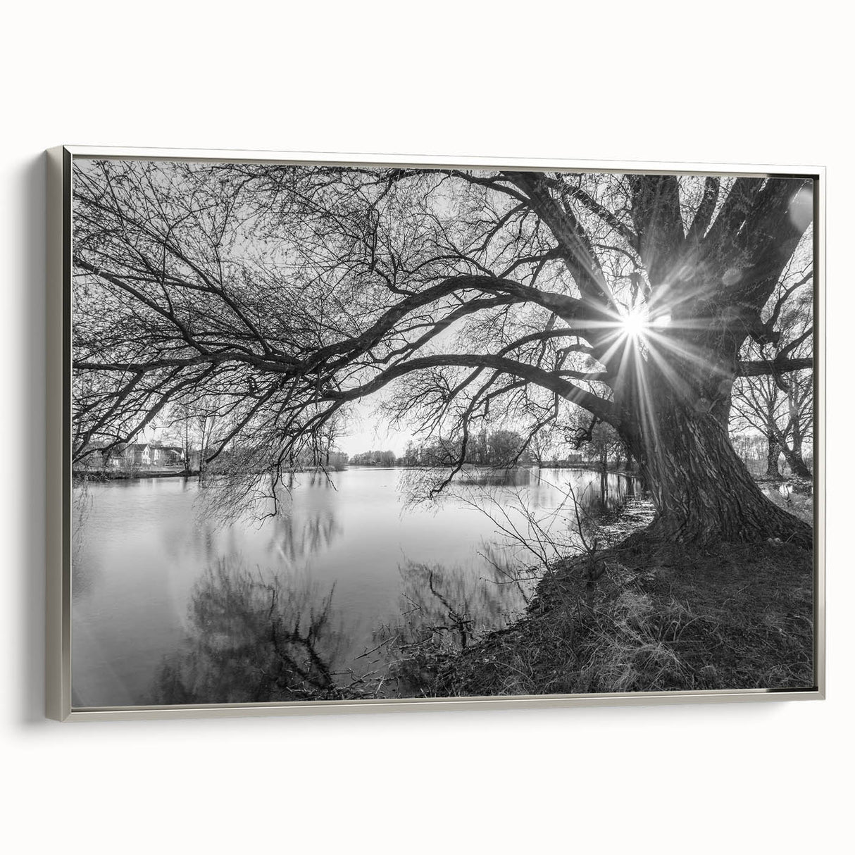 Framed canvas wall art showcasing a serene lake landscape design with silver accents, perfect for enhancing modern home decor. The piece evokes tranquility and nature.