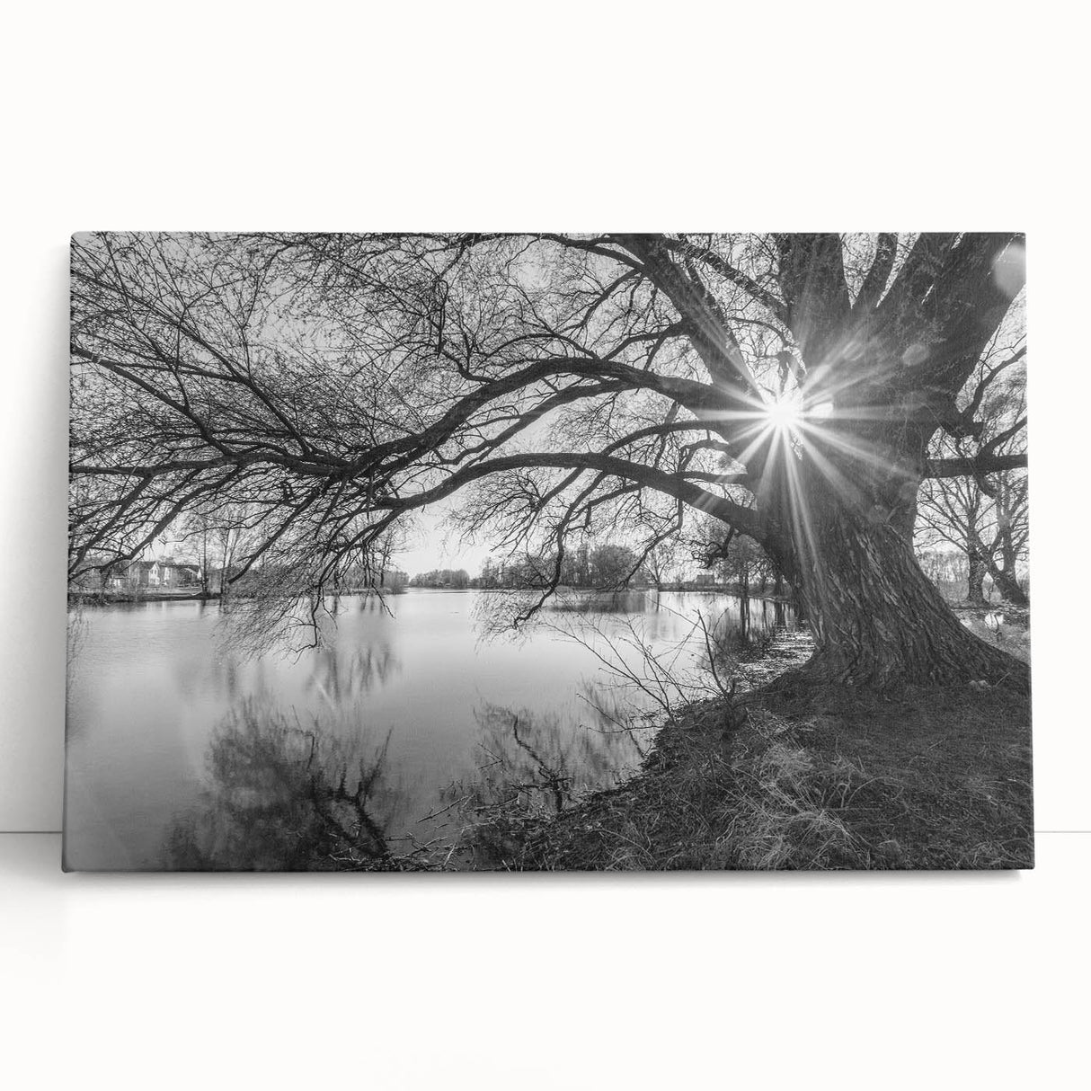 Stretched canvas wall art featuring a serene lakeside landscape, showcasing vibrant blues and greens, ideal for home decor or office ambiance. This artwork adds tranquility and nature-inspired elegance to any space.