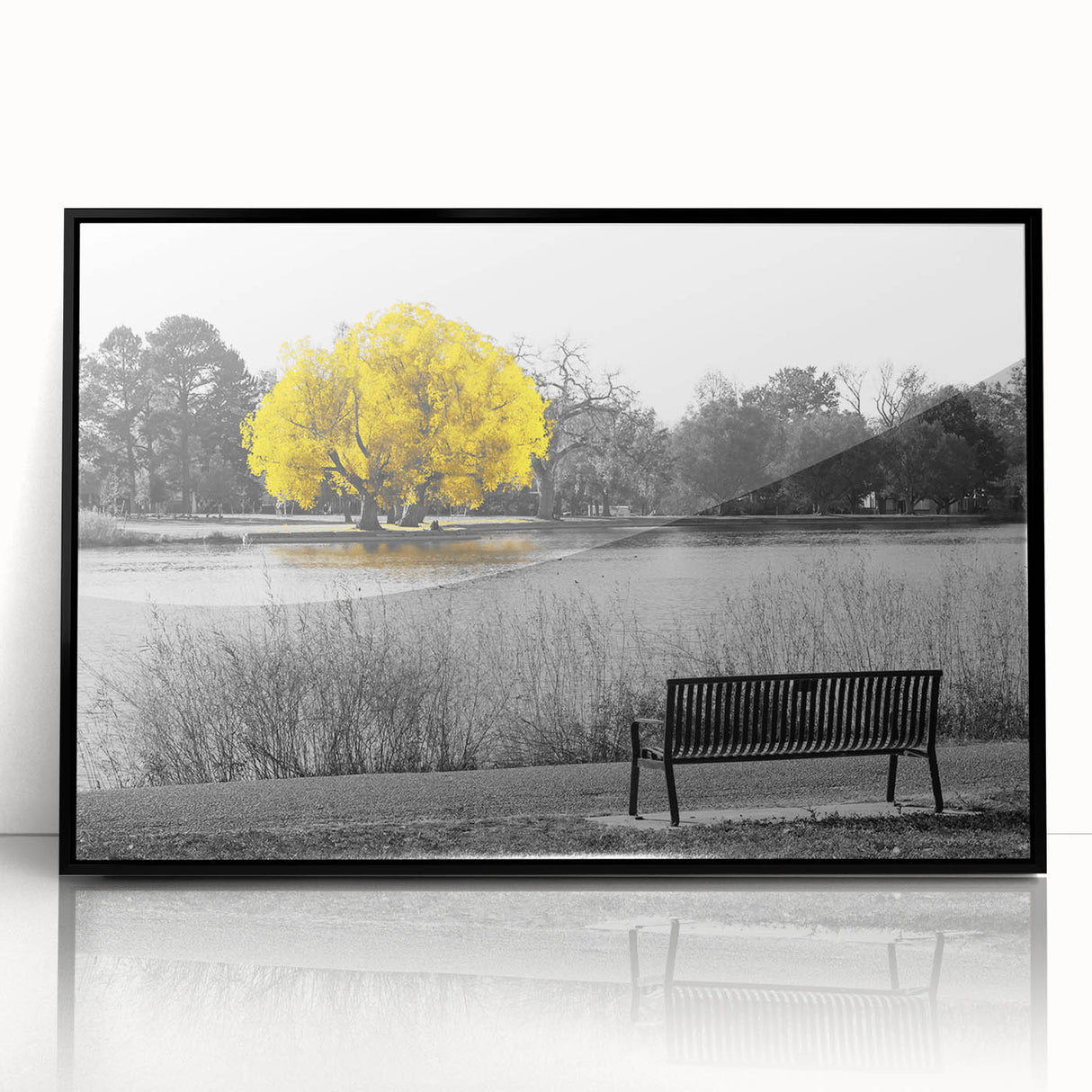 Framed wall art featuring a serene landscape with a tranquil lake and lush greenery, presented in a sleek black frame, perfect for home decor enhancement.