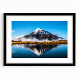 Framed wall art featuring a serene landscape with a tranquil lake, surrounded by lush greenery, showcased in a sleek black frame with a white mat. Ideal for enhancing home decor with nature-inspired elegance.