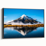 Framed canvas wall art showcasing a serene lake landscape design, featuring lush greenery and calm waters, presented in a sleek black frame for an elegant display.