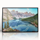 Framed acrylic wall art showcasing a serene landscape with a tranquil lake, surrounded by lush greenery, featuring a modern black frame that enhances its elegance. Perfect for home decor, this artwork adds a calming ambiance to any room.