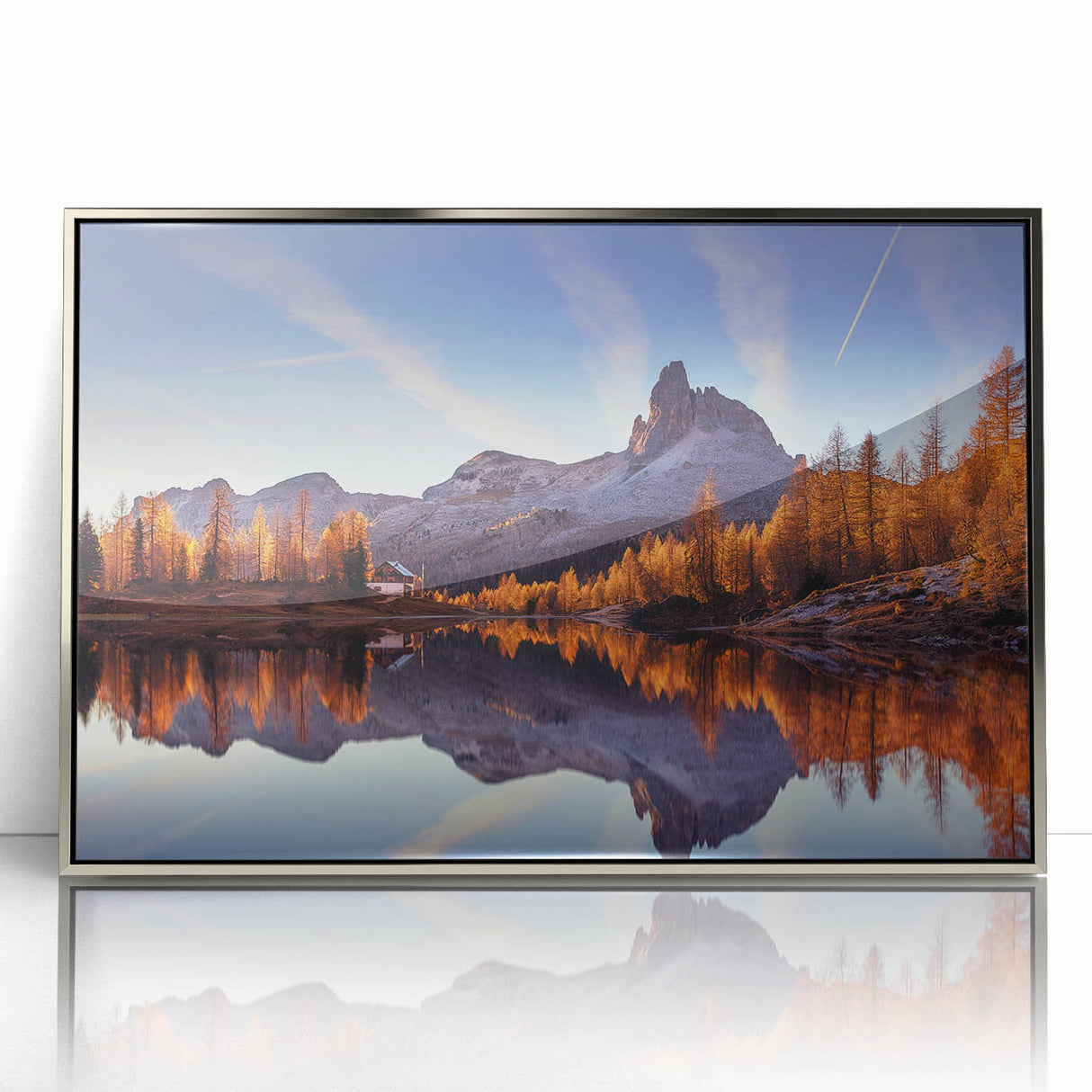 Framed wall art showcasing a serene lake landscape with vibrant colors, set in a sleek silver frame, perfect for enhancing modern home decor.