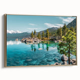 Framed canvas wall art depicting a serene lakeside landscape with rich, vibrant colors and a gold frame, showcasing nature's beauty in a stylish setting.