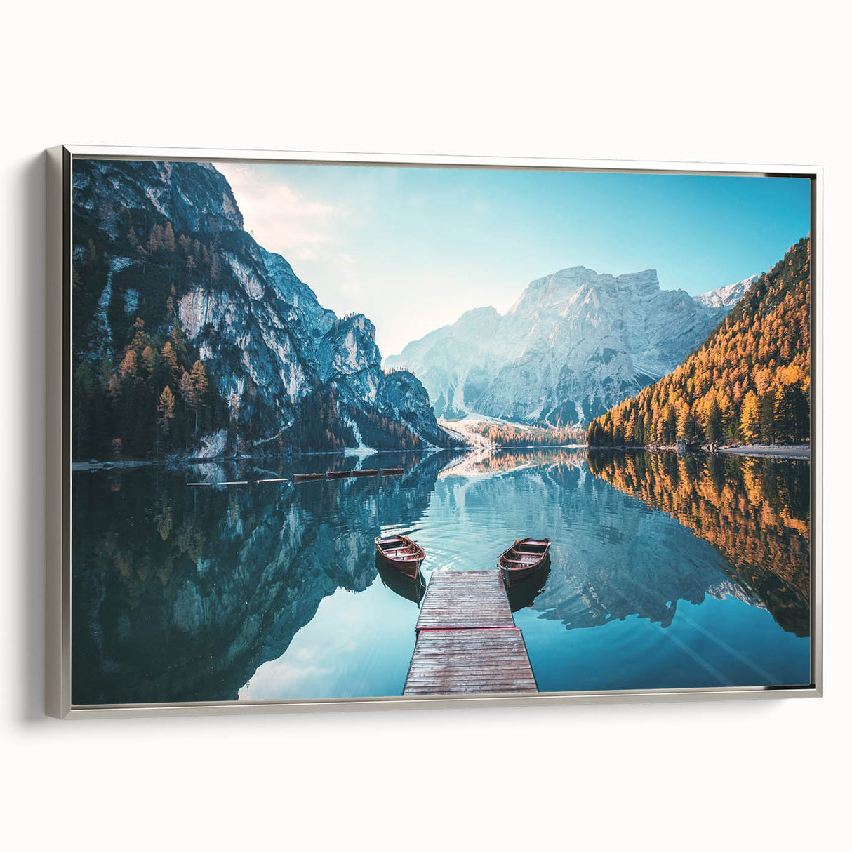 Framed wall art featuring a serene lake landscape design in soft blue and green hues, highlighted with a sleek silver frame, ideal for modern home decor.