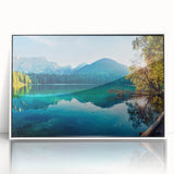Framed landscape wall art depicting serene lakes and mountains, featuring a white frame and acrylic front, perfect for home decor in modern settings.