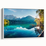 Framed canvas wall art featuring a serene lake landscape design, showcasing tranquil blue water and lush green trees, presented in a sleek white frame.