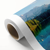 Vibrant rolled canvas artwork depicting a serene lake landscape with lush greenery and a clear blue sky, ideal for home decor and nature enthusiasts.