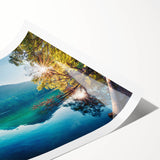 Colorful rolled print of a tranquil lake landscape with vibrant trees, showcasing a serene nature scene, ideal for home decor or office ambiance.