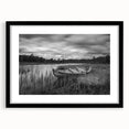 Framed wall art showcasing a serene lake landscape with vibrant colors, featuring a black mat and frame, ideal for enhancing home decor.