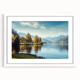 Framed wall art featuring serene lake and landscape design in soft blues and greens, elegantly displayed with a white mat, perfect for home decor enhancement.