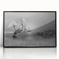 Framed wall art collection showcasing a serene landscape of a tranquil lake, featuring vibrant colors and a sleek black frame, ideal for home decor.