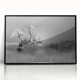 Framed wall art collection showcasing a serene landscape of a tranquil lake, featuring vibrant colors and a sleek black frame, ideal for home decor.