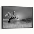 Framed canvas wall art showcasing a serene lake landscape with lush greenery and a vibrant sunset, viewed from the side in a sleek black frame. Perfect for enhancing home decor.